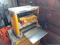 Front view showing infeed/outfeed table and cutterhead area