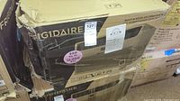 Front view of boxed unit showing Frigidaire branding and MaxSold tag