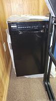 Full view of black Frigidaire dishwasher showing front and side profile.