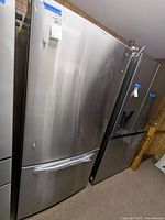 Full front view of LG stainless steel refrigerator with bottom freezer