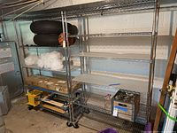 Full view of two assembled shelving units loaded with items.