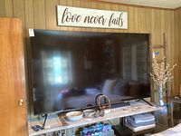 Front view of 86-inch Samsung TV on a console table in living room