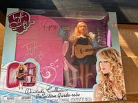 Front of boxed Taylor Swift Wardrobe Collection doll with signature visible on packaging