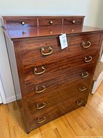 Front view showing full drawer configuration and finish