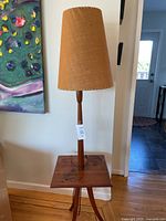Full view of teak floor lamp with integrated side table