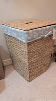 Photo showing the seagrass hamper with fabric lining and woven lid with handle slot