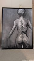 Frontal view of the unsigned black and white female nude painting in black floater frame, showing the full figure from the back.