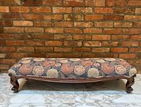 Full front view of bench against brick wall