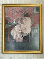 Full view of the framed vintage L.T. Piver perfume advertisement print against wallpaper background.