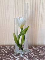 Full view of the satin glass double vase with two frosted tubes and tulip flower attached.