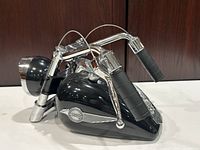 Front-angle view showing gas tank body, handlebars and headlight