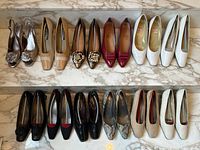 Two-tier display of 16 pairs of women’s shoes in neutral, metallic and colored finishes