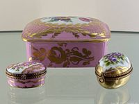 All three trinket boxes (rectangular, oval, egg-shaped) arranged on mirrored surface