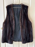 Full front view of brown mink fur vest on hanger