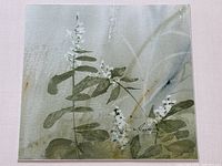 Close-up of painting detail showing abstract floral watercolour and artist signature