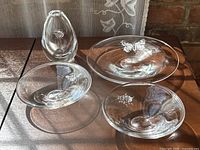 All four crystal pieces together on a wood surface