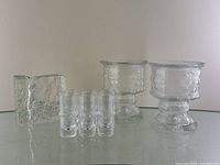 Group photo showing all glassware items including the 6 Iittala shot glasses, rectangular glass block vase, and 2 LE Smith candle holders.