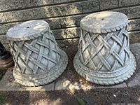 Front view of both planters side by side showing woven lattice pattern and rope-like rim