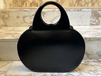 Front view showing overall oval shape and integrated top handles