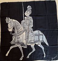 Full view of scarf laid flat showing entire knight-on-horse design