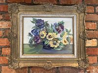 Full frontal view of the painting and ornate gold frame