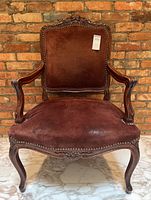 Front view of chair showing overall design, upholstery and frame