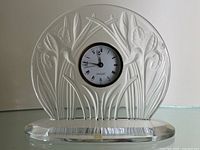 Front view of the crystal clock showing full relief design and dial