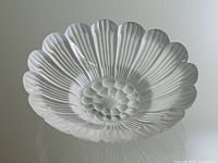 Front view of frosted crystal flower dish showing petal design and central disk