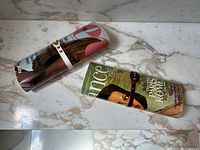 Both clutches side by side on marble surface