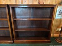 Frontal view of bookcase showing overall structure and three shelves