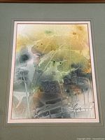 Close-up view of the painting showing abstract color washes and partial signature