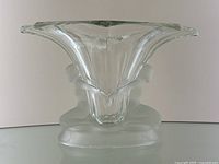 Front view of clear and frosted glass vase with twin kneeling female figures and flared rim