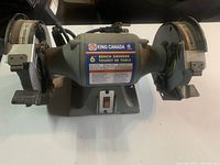 Full view of the King Canada 6 inch dual bench grinder with protective guards and power cord.