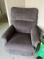 Front view of brown fabric Lazy Boy recliner chair showing cushioned backrest and armrests.