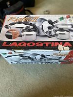 Box of Lagostina Rialto II cookware set showing brand and model, with Italian flags and Sears store labels.
