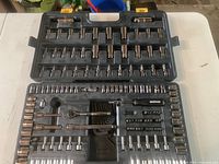 Overview of the open mechanics socket set showing arrangement of sockets, ratchet, extensions, hex keys, and bits.