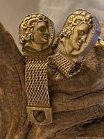 Close-up photo of both gold tone mesh wrap cuff links showing detailed Roman coin style horned Satyr Pan cameo faces