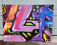 Front view of the colorful abstract painting showing bold geometric shapes and vivid colors.