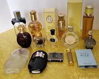 Front view of all perfume bottles and boxes on yellow surface