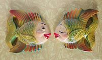 Both colorful mid-century style fish wall hangings displayed face-to-face showing overall condition and paint detail.