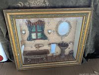 Full view of the framed Victorian bathroom diorama showing the bathtub, sink, window, mirror, and wall sconces.