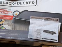 Original product box showing Black+Decker electric griddle branding, product image and features in Spanish.