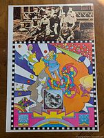 Photo showing entire poster including colorful psychedelic pop art images, central vintage group photo, and artist signature at bottom.