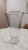 Front view of the large clear crystal vase showing cylindrical shape and flared rim