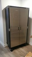 Front view of closed cabinet showing stainless steel finish doors and recessed handles