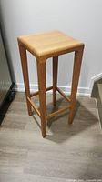 Side view of the oak bentwood bar stool showing entire form and finish.