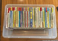 Top-Down View of 36 Archie Comics in a plastic container, showing spines with titles and colors