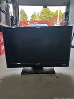 Front view of Sony flat screen TV turned off, showing screen and logo.