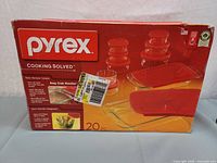 Box front showing Pyrex 20-piece Bake N Store set with images of glass containers and lids