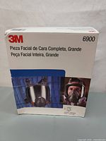 3M 6900 Large Full Facepiece Respirator box front showing product image and model number in Spanish and Portuguese.